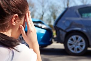 Car Accident Lawyer Decatur, GA- upset woman looking at car wreck
